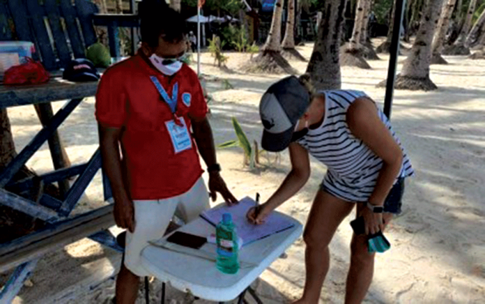 boracay A tourist registers at the lifeguard station before swimming in the waters of Boracay Island. PNA/ YES THE BEST BORACAY