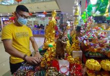 Luck in a trove of charms Feng Shui stall vendor Melvin Aranda says people patronize good luck items believing they will bring prosperity and fortune. GLENDA TAYONA/PN