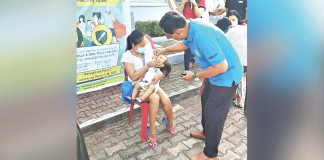 A CHILD receives oral polio vaccine during the kickoff of the Measles-Rubella Oral Polio Vaccine Supplemental Immunization Activity in Jordan, Guimaras. JORDAN LGU PHOTO
