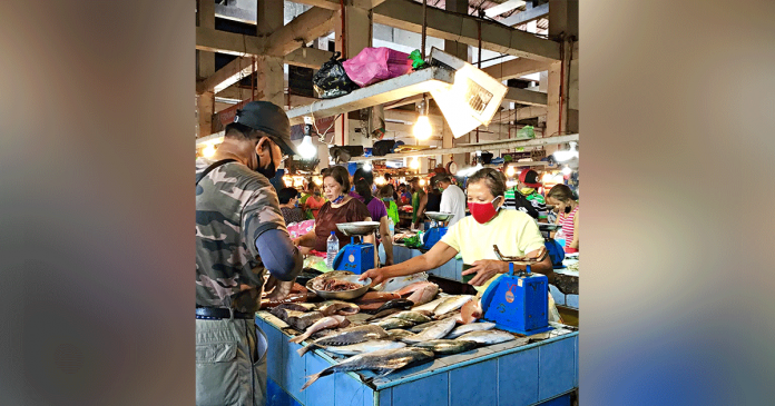 kalibo-market Market vendors and consumers wear facemask – well, not all of them – at the public market of Kalibo, Aklan. The partly fire-damaged market needs rehabilitation.