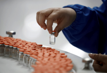 Quality checks are performed in the packaging facility of Chinese vaccine maker Sinovac Biotech in Beijing in September of last year. REUTERS