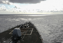 US ship sails in South China Sea by China-claimed islands The USS Russell operates in the South China Sea on Wednesday. U.S. NAVY