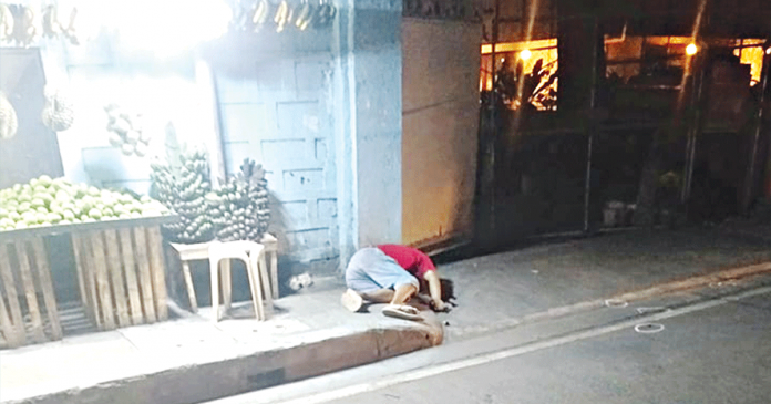 odicta Drug surrenderer Agustin Odicta lies dead along the road in Barangay Tabucan, Mandurriao, Iloilo City on Feb. 18. CONTRIBUTED PHOTO