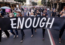 Australian PM admits public anger after report of lewd acts Protesters with placards and banners rally around Australia on March 15, 2021 to demand justice for women. AP