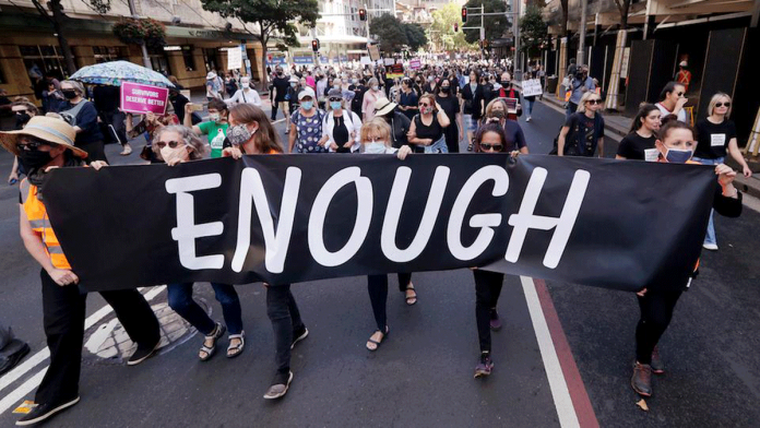 Australia Protesters with placards and banners rally around Australia on March 15, 2021 to demand justice for women. AP