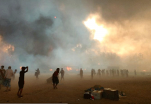 Bangladesh probes fire at Rohingya refugee camp Refugees stand amid smoke after a fire broke out at Rohingya refugee camp in Cox's Bazar, Bangladesh, March 22, 2021. REUTERS/STRINGER/FILE