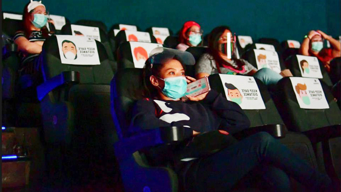 Film-industry Movie watchers observe safety protocols in a cinema house. The Film Development Council of the Philippines reported that the country’s movie industry is losing P12 billion due to the coronavirus disease 2019 pandemic. MARK DEMAYO, ABS-CBN NEWS/FILE