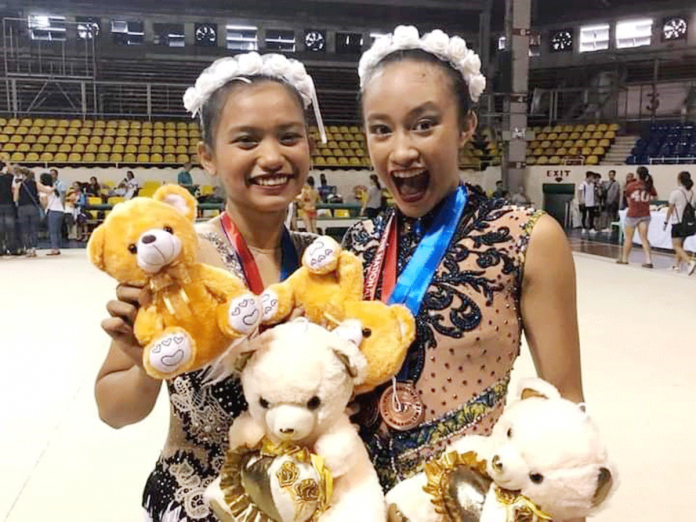 Gymnastics Negrense gymnasts Althea Descutido (left) and Kiana Marie Alagaban (right) reap two gold medals each during the 1st MK Rhythmic Gymnastics International Online Competition recently. ALTHEA DS