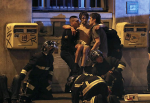 Police arrest man suspected of helping Bataclan attackers French fire brigade members aid an injured individual near the Bataclan concert hall following fatal shootings in Paris, France on Nov. 13, 2015. REUTERS/CHRISTIAN HARTMANN