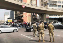 Lebanese army starts clearing roadblocks after week of protests Cars block a highway during a protest against the fall in Lebanese pound currency and mounting economic hardships, in Jal el-Dib, Lebanon on March 9, 2021. REUTERS/ISSAM ABDALLAH/FILE