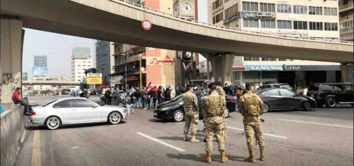 Cars block a highway during a protest against the fall in Lebanese pound currency and mounting economic hardships, in Jal el-Dib, Lebanon on March 9, 2021. REUTERS/ISSAM ABDALLAH/FILE