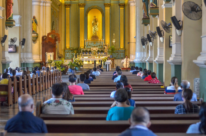 Nation-1-banner Devotees attend a mass in Jaro Metropolitan Cathedral in Iloilo City. Churchgoers observe physical distancing to prevent the spread of coronavirus disease 2019. In “NCR plus” churches are allowed by the Inter-Agency Task Force for the Management of Emerging Infectious Disease to conduct a “once-a-day” religious gathering during Holy Week. PANAY NEWS PHOTO