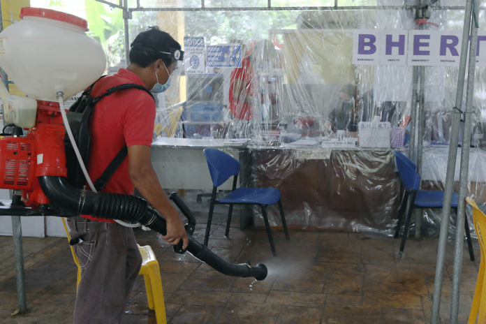 Nation-2 A man disinfects the Barangay Health Emergency Response Team office in Novaliches Fairview, Quezon City. This move, aims to prevent the spread of coronavirus disease 2019 (COVID-19). Based on the Data from the Department of Health, the country has a total of 731,894 COVID-19 cases. OLIVER MARQUEZ/PNA