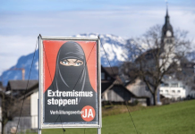 Switzerland votes to ban face coverings in public Posters promoted by the Swiss People's Party feature a woman in a black niqab and captions such as "Stop extremism!" and "Stop radical Islam!" EPA VIA BBC