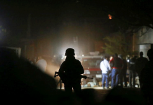 Truck-borne gunmen kill 11 in Mexico’s western state of Jalisco A soldier guards the area where 11 people were killed when unidentified gunmen riding in a truck opened fire in Tonala, State of Jalisco, Mexico on Feb. 27, 2021. REUTERS/FERNADO CARRANZA