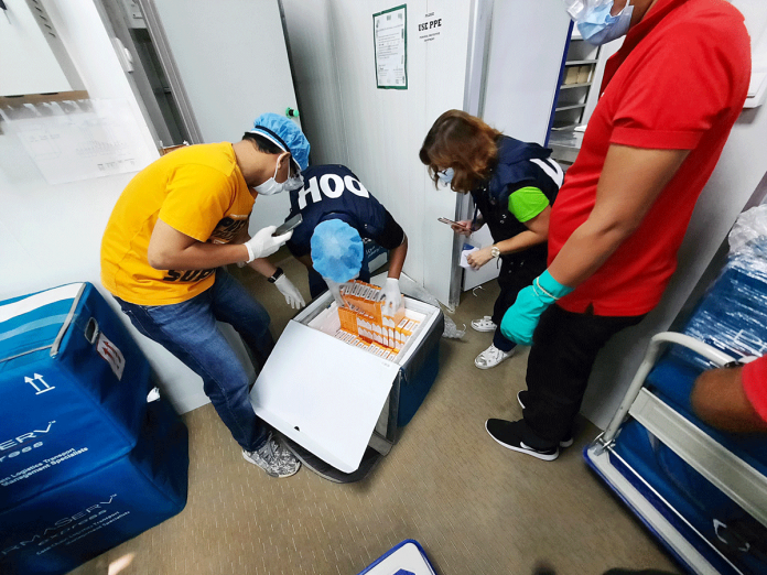 doh-pic MORE VACCINES. Personnel of the Department of Health (DOH) in Western Visayas check the additional anti-coronavirus shots delivered to Iloilo City yesterday, March 10, 2021. According to the DOH, 10,000 doses from AstraZeneca and 16,880 from Sinovac were donated to the region for the vaccination of healthcare workers. DOH WESTERN VISAYAS