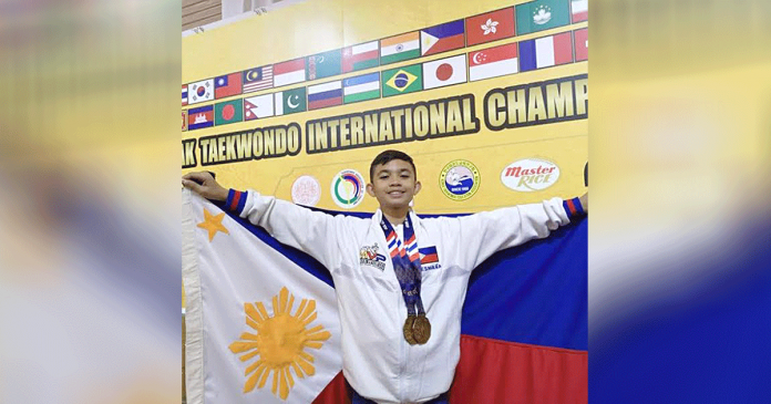 esmana Ilonggo Cyd Edryc Esmaña proudly holds the Philippine flag with medals hanging around his neck. He lands at second place in the overall male championship of the 3rd Lents Taekwondo Worldwide Sports Online Poomsae Open Championships.