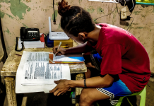 ‘NOT THE RIGHT TIME’; Parents, teachers jittery over face-to-face classes’ resumption Jerry Calzado, 16, a student of Cayos National High School in Dumangas, Iloilo, answers his learning module. He prefers distance learning because while at home he could help his parents with the household chores. Panay News Photo