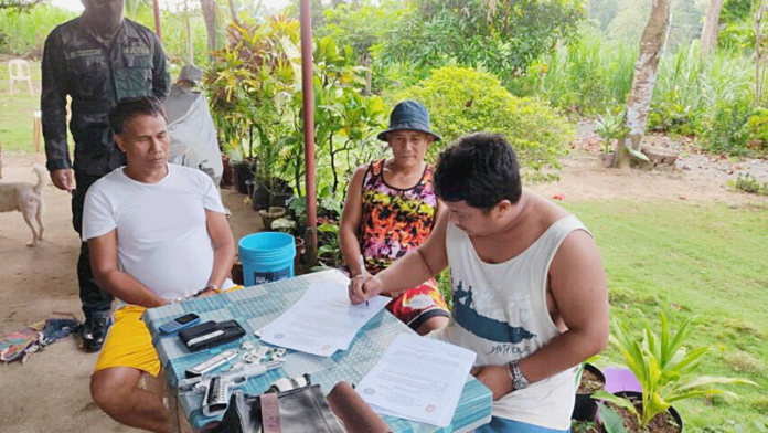 kap1 Barangay Captain Joewinny Giganto (left) of Barangay Calang, Dueñas, Iloilo was arrested yesterday, March 2. A grenade and a .45-caliber pistol loaded with seven live ammunitions were recovered from his possession. PRO-6