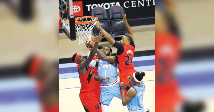 nba Houston Rockets’ John Wall (center) drives to basket as he was sandwiched by Toronto Raptors’ Pascal Siakam (left) and Norman Powell (right) during their 2020-2021 NBA Season game on Monday night. AP PHOTO