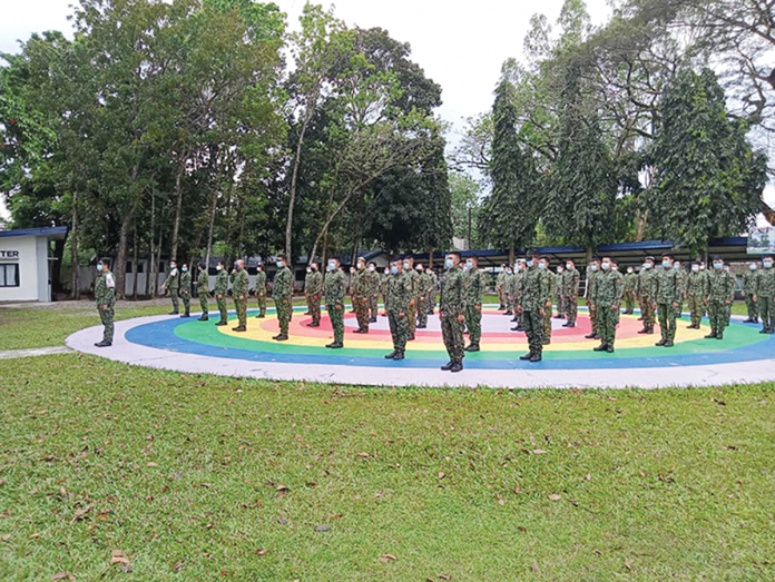 nocppo Cops join a flag ceremony in Camp Alfredo M. Montelibano Sr. in Bacolod City. Ninety-nine percent of police officers of the Negros Occidental Police Provincial Office signified willingness to be vaccinated against coronavirus disease 2019 (COVID-19). NOCPPO/FACEBOOK