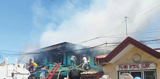 Residents and firemen put out fire that gutted two ancestral houses in Barangay Poblacion Ilaya, Passi City, Iloilo on Monday. CIO LGU PASSI