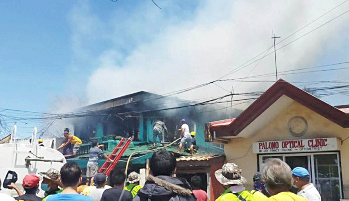passi-fire Residents and firemen put out fire that gutted two ancestral houses in Barangay Poblacion Ilaya, Passi City, Iloilo on Monday. CIO LGU PASSI