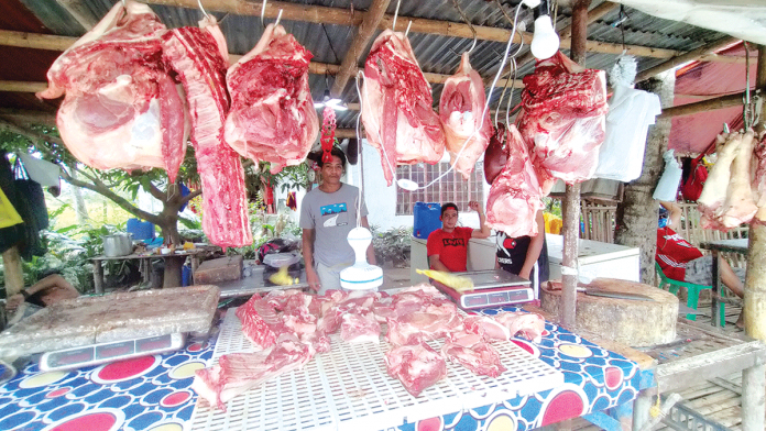 pork-meat Pork is displayed in a stall along the highway in Leganes, Iloilo. For Sen. Francis Pangilinan, the government may lose P11 billion in revenues if tariff on pork imports is reduced from 30 percent to five percent. PANAY NEWS PHOTO