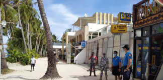 Tourists are sparse, according to these policemen monitoring the situation of Boracay Island’s beachfront. PHOTO BY MALAY POLICE STATION