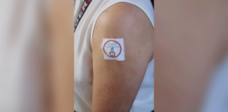 ‘COVID-19 VACCINATED’ A healthcare worker gets her first dose of Sinovac vaccine at the Western Visayas Medical Center in Mandurriao, Iloilo City.