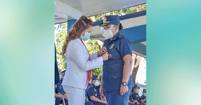 Police Major Liza Nofuente, chief of the Women and Children Protection Desk of the Iloilo Police Provincial Office, receives a medal from Iloilo City’s Rep. Julienne Baronda during the kick-off ceremony of the 2021 National Women’s Month celebration on March 1 in Camp Delgado. PRO-6