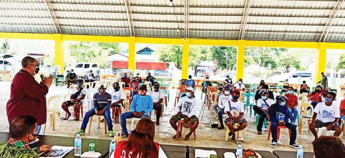 DSWD-livelihood Western Visayas Regional Task Force ELCAC’s spokesperson and chairman of the Legal Cooperation Cluster Prosecutor Flosemer Chris Gonzales delivers his messgae to the former rebels. PIA