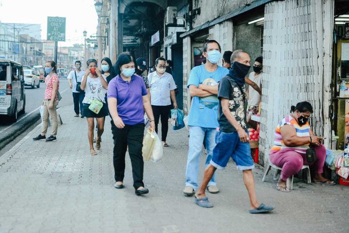 Nation-1-banner Wearing facemasks, residents stroll in the downtown of Iloilo City. While the NCR Plus will shift to modified enhance community quarantine, Western Visayas will remain under modified general community quarantine for the month of April.PN FILE PHOTO