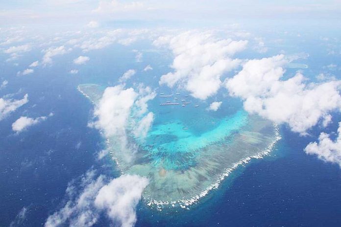 Nation-1-banner This is the Julian Felipe Reef in the West Philippine Sea. It is a large boomerang-shaped shallow coral reef at the northeast of Pagkakaisa Banks and Reefs (Union Reefs), located approximately 175 nautical miles west of Bataraza, Palawan. Hundreds of Chinese vessels were seen in this area and China claims that it is a part of its territory. ARMED FORCES OF THE PHILIPPINES VIA ABS-CBN NEWS