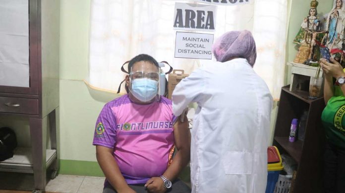 This frontliner in Lambunao, Iloilo receives his first dose of AstraZeneca’s coronavirus disease 2019 vaccine recently. The lack of vaccine supply in the Philippines caused delay to its vaccination drive and prompted the national government to ask for leftover or unused shots from other countries. CEC INFOCENTER LAMBUNAO