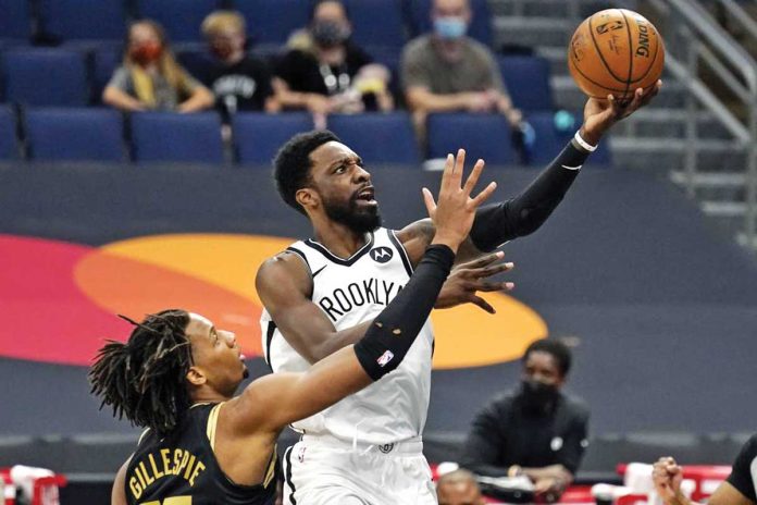 Brooklyn Nets’ Jeff Green (8) goes up for a shot against Freddie Gillespie (55) of the Toronto Raptors during the first half of their basketball game on Tuesday in Tampa, Florida. AP PHOTO/CHRIS O'MEARA