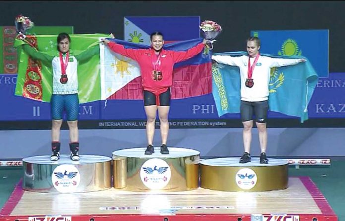 Sports-2 Filipina weightlifter Vanessa Sarno (center) wins two gold medals for the country in the Asian Weightlifting Championship at Tashkent, Uzbekistan. IWF LIVEFEED VIA ABS-CBN NEWS