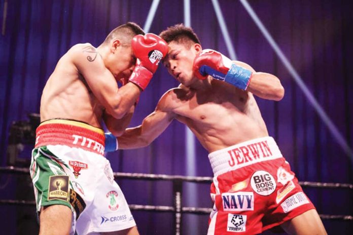 Sports-3 Filipino boxer Jerwin Ancajas (right) connects a right hook punch to the body of Mexican Johnathan Rodriguez during their IBF world super flyweight match, Saturday, at Mohegan Sun Arena in Connecticut, United States of America. SHOWTIME