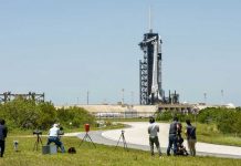Photographers set up remote cameras for the launch of a SpaceX Falcon 9 rocket, with the Crew Dragon capsule, outside Pad 39A for a mission to the International Space Station at Kennedy Space Center in Cape Canaveral, Florida. REUTERS/STEVE NESIUS