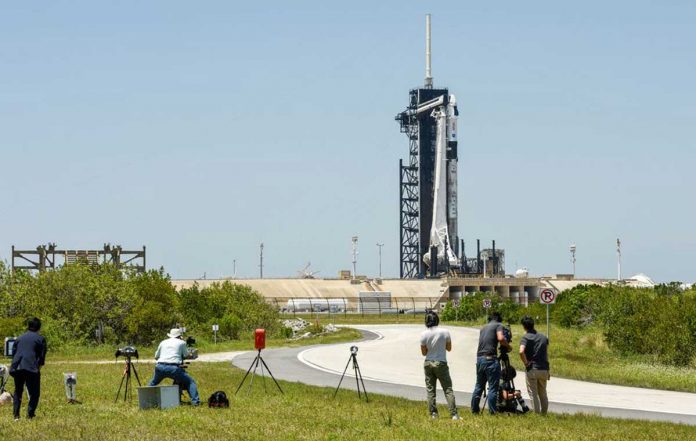 World-3 Photographers set up remote cameras for the launch of a SpaceX Falcon 9 rocket, with the Crew Dragon capsule, outside Pad 39A for a mission to the International Space Station at Kennedy Space Center in Cape Canaveral, Florida. REUTERS/STEVE NESIUS