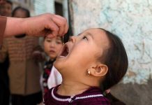 Afghans work to stem polio rise amid violence, pandemic Shabana Maani, gives a polio vaccination to a child in the old part of Kabul, Afghanistan, Monday, March 29, 2021. AP