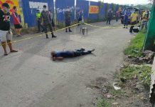 Policemen cordon the area where an ex-convict was shot to death by unidentified riding-in-tandem assailants on April 26. POLICE STATION 1/BCPO
