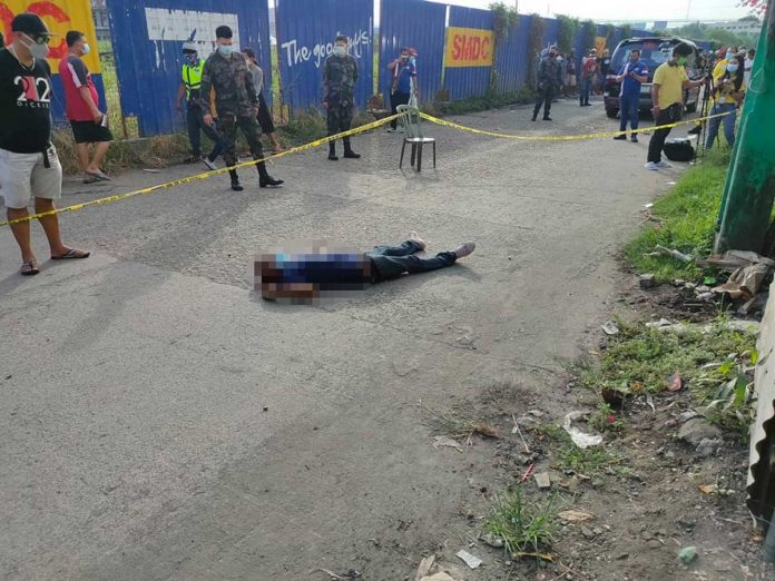 ex-convict-shot Policemen cordon the area where an ex-convict was shot to death by unidentified riding-in-tandem assailants on April 26. POLICE STATION 1/BCPO