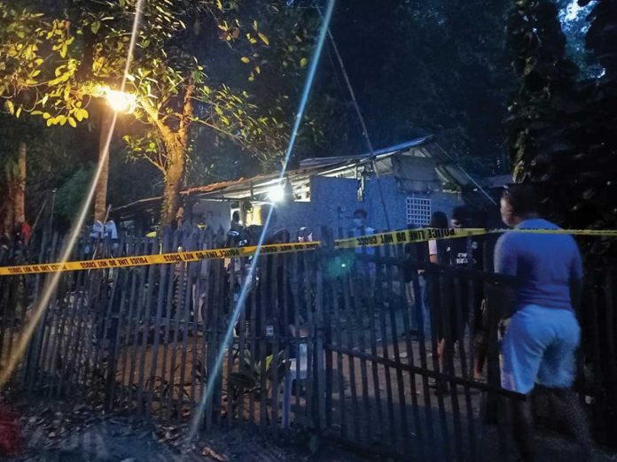 ex-drug-convict Police cordon the area where an ex-convict was killed in a shootout with police officers in Sitio Cantil, Barangay Damires, Janiuay, Iloilo yesterday. RUBY SILUBRICO/PN