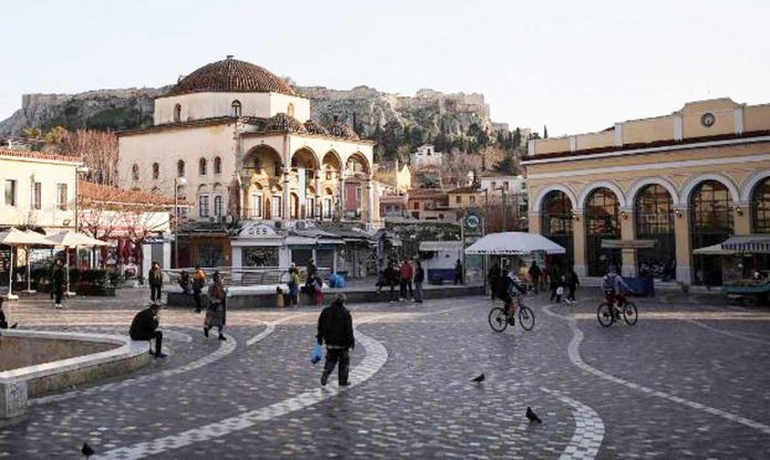 greece-lift-quarantine People stroll on Monastiraki Square in Athens, Greece amid the coronavirus disease 2019 pandemic. The country plans to lift its quarantine restrictions for travelers next week. REUTERS/LOUIZA VRADI