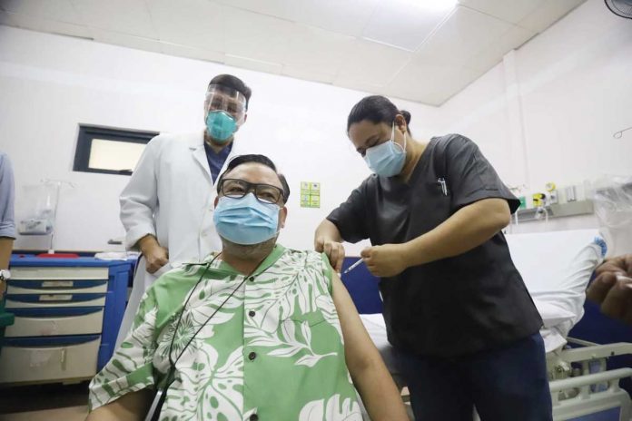 ilo-pic Iloilo Cityās Mayor Jerry TreƱas gets his first dose of CoronaVac vaccine against coronavirus disease 2019 at the West Visayas State University Medical Center in La Paz district. He said he felt completely fine after the vaccination. ARNOLD ALMACEN/CMO