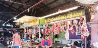 A meat vendor tends his beef and pork stall in the public market of Pavia, Iloilo. Pork prices in the region now hover around P255 per kilo on average compared to last month’s P245. PANAY NEWS PHOTO