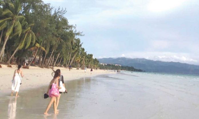 region-boracay-NBI Over 100 tourists were caught with fake coronavirus disease test results since the reopening of Boracay Island to domestic tourists in October 2020.