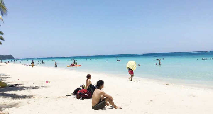 region-boracay-variant Boracay Island is experiencing a surge in coronavirus disease 2019 cases. A “superspreader” party at a bar there on March 10 is being blamed.