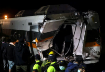 Rescuers work to bring out last body from wrecked train